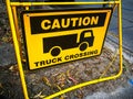 Caution sign for truck crossing.