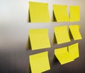 Yellow square stickers are glued to the refrigerator. Sheets for recording information