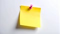 Single yellow square sticky note fastened with a pink pushpin on a clean white background Royalty Free Stock Photo