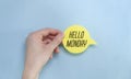 the yellow stacking of white business card with Hello Monday message on vibrant blue background , cheerful for happy working time. Royalty Free Stock Photo