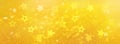 Yellow stars on gold background with bokeh. Texture for new year, birthday, baby shower party. Creative pattern. Banner