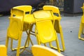 Yellow steel chair at outdoor restaurant or beer garden Royalty Free Stock Photo