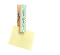 Yellow stick note paper pinned on peg