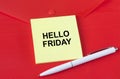 Yellow sticker with text Hello Friday on red folder Royalty Free Stock Photo