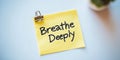 Yellow Sticky Note With Breathe Deeply Text On A Bulletin Board, Stress Relief Concept Royalty Free Stock Photo
