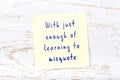 Yellow sticky note with handwritten motivational quote