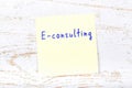 Yellow sticky note with handwritten text econsulting Royalty Free Stock Photo
