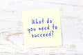 Yellow sticky note with handwritten text what do you need to succeed Royalty Free Stock Photo