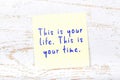 Yellow sticky note with handwritten text this is your life this is your time Royalty Free Stock Photo