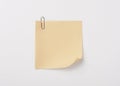 Yellow sticky note with paper clip with shade Royalty Free Stock Photo