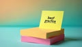 Yellow sticky note with text best practice rests on stack of memo papers. Idea for business planning or strategy. Simple Royalty Free Stock Photo