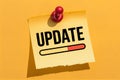 Yellow sticky note with UPDATE text and red progress bar, symbolizing progress Royalty Free Stock Photo