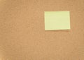 Yellow sticky notes on cork bulletin board Royalty Free Stock Photo