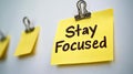 Yellow Sticky Notes Pinned On White Background, Reminder To Stay Focused Note, Close-up Royalty Free Stock Photo