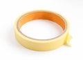 Yellow sticky tape roll isolated on white. Duct tape close-up