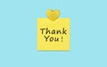 Yellow sticky thank you note and heart. Royalty Free Stock Photo