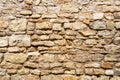 Yellow stone wall. Texture of a stone wall Royalty Free Stock Photo