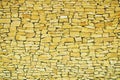 Yellow stone wall texture. Royalty Free Stock Photo