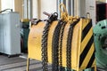 Yellow storage rack for chain slings for lifting loads on a crane Royalty Free Stock Photo