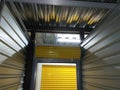 Yellow Storage Unit Facility Doors Rolled Up From the Inside Royalty Free Stock Photo