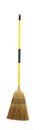 Yellow straw broom on white Royalty Free Stock Photo