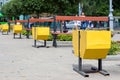 Yellow street garbage bin Royalty Free Stock Photo