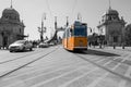 yellow streetcar in front of the freedom bridge in budapest Royalty Free Stock Photo