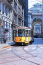 yellow streetcar in the streets of milan city in italy