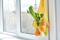 Yellow string shopping bag with vegetables and fruits Royalty Free Stock Photo