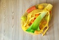 Yellow string shopping bag with vegetables and fruits Royalty Free Stock Photo