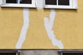 white stripes of repair areas on a yellow house Royalty Free Stock Photo