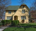 Yellow Stucco House with Patchwork Roof