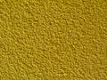 Yellow stucco texture on exterior wall with fine grains Royalty Free Stock Photo