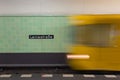 Yellow subway train in motion on Berlin Alexanderplatz underground station. Royalty Free Stock Photo