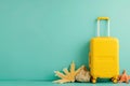 a yellow suitcase with seashells and starfish on a blue background Royalty Free Stock Photo