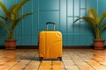 A yellow suitcase sitting on a tiled floor. Blue background and palms. Minimalist touristic concept