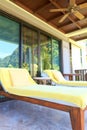 Yellow sunbeds on the balcony room Royalty Free Stock Photo