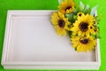 yellow sunflowers on a pink tray