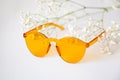 Yellow sunglasses with delicate flower decor