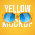 Yellow sunglasses on yellow background.