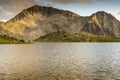 Yellow Sunset over Tevno Lake and Kamenitsa peak, Pirin Mountain Royalty Free Stock Photo