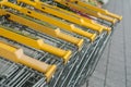 Yellow supermarket trolleys alignment
