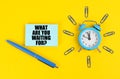 On the yellow surface there is an alarm clock, a pen and stickers with the inscription - What Are You Waiting For Royalty Free Stock Photo