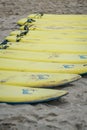 Yellow surfing boards on a beach Royalty Free Stock Photo