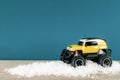 yellow SUV monster car truck toy in winter snow Royalty Free Stock Photo