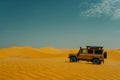 Off-road vehicle adventure in vast desert landscape Royalty Free Stock Photo