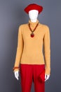 Yellow sweater and red trousers for women. Royalty Free Stock Photo
