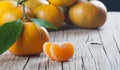 Yellow sweet isolated peeled and whole mandarin clementine tangerine on wooden rustic vintage table with leaf. Tangerines backgrou Royalty Free Stock Photo