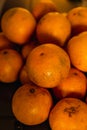 Yellow sweet oranges, stacked on a black table. Accommodated for sale. 3