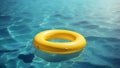 yellow swimming pool ring float in blue water Royalty Free Stock Photo